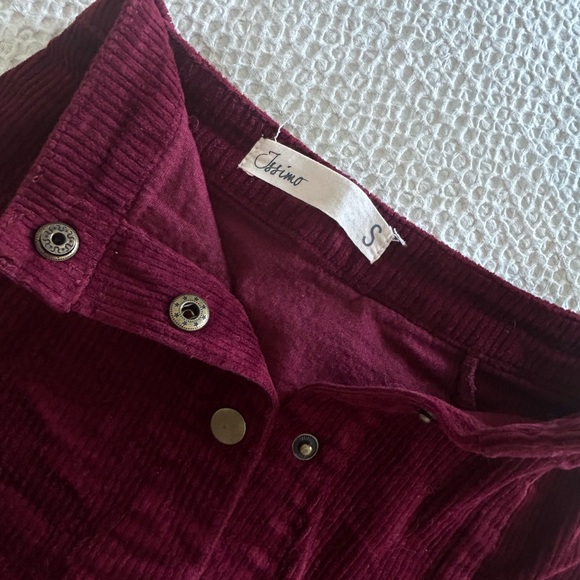 Rich, crimson red, velvet skirt, with pop buttons down the middle. - Picture 2 of 3